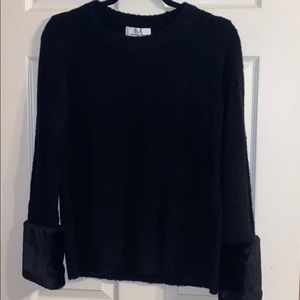 Black Sweater with fur at end of sleeves